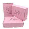 pink corrugated box with black logo